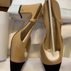 CHANEL Tan and Black Heeled Boots with Logo Charm